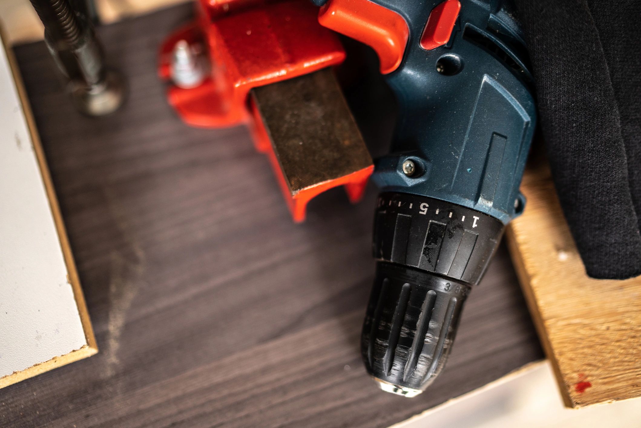 Close-up of a drill on a work surface